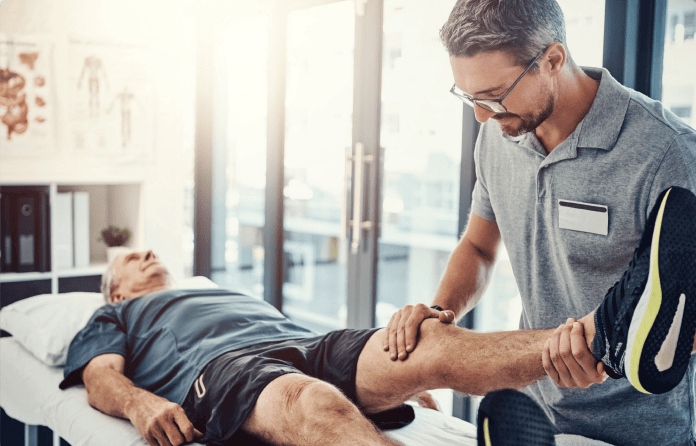 Physical Therapist Helping Client